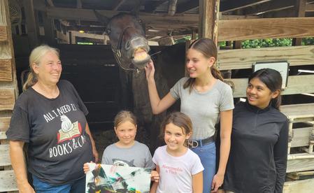 Family with horse at the barn